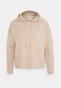 Beige Strick-Hoodie mit langen Ärmeln, Kordelzugkapuze und lässigem Schnitt, präsentiert auf einem schlichten weißen Hintergrund.