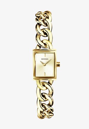 Montre rectangulaire dorée avec un cadran texturé et un bracelet à maillons. Présente un design minimaliste avec des maillons audacieux et le nom de la marque affiché.