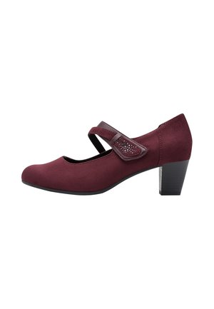 Scarpa Mary Jane in camoscio bordeaux con tacco a blocco di altezza media e cinturino decorativo con piccoli borchietti per la chiusura.