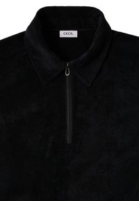Camicia di velluto a coste nera con design con colletto, dotata di una zip frontale e una texture sottile. L'etichetta riporta "CECIL" all'altezza del collo.