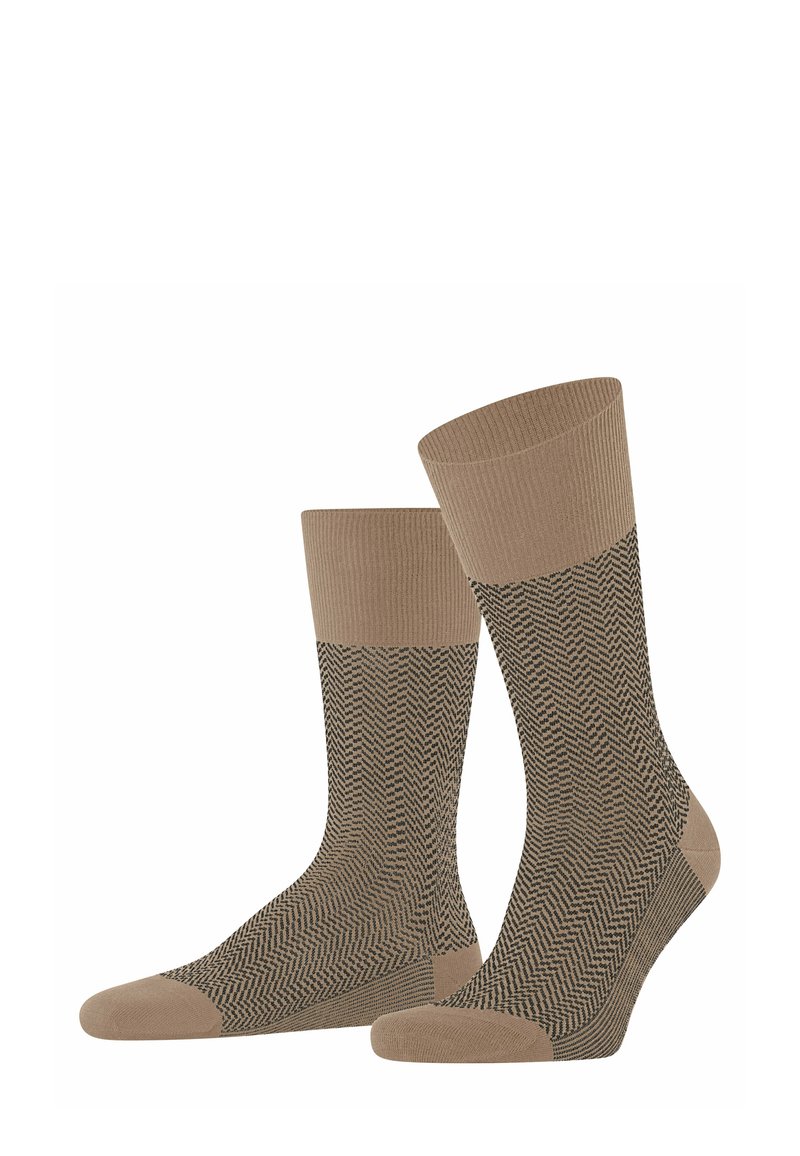 Braune Socken mit Fischgrätmuster, gerippten Bändern oben und einfarbigen braunen Zehen. Weicher Stoff mit mittlerer Höhe.