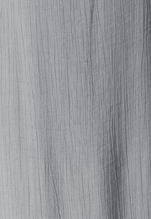 Light gray fabric with subtle vertical creases and fine woven texture.