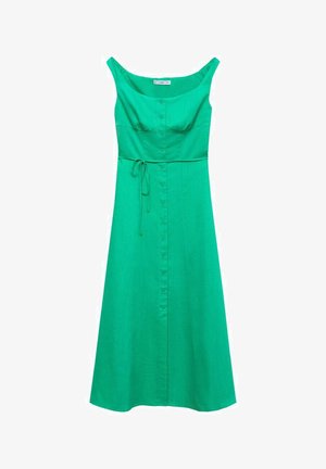 Vihreä mekko, jossa on avara kaula-aukko, istuva yläosa ja levenevä hame. Ominaisuuksiin kuuluu napitettava etuosa ja solmittava vyötäröyksityiskohta. Sileä kangas.