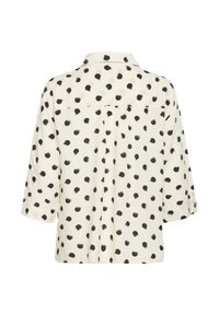 Camicia bianca con motivo a pois neri. Collo con bottoni, maniche tre quarti e vestibilità morbida. Tessuto dalla texture morbida.