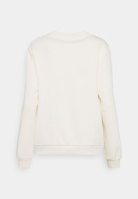Kremowy sweatshirt z długimi rękawami, ściągaczami u dołu i na rękawach. Gładka faktura i klasyczny krój z okrągłym dekoltem.