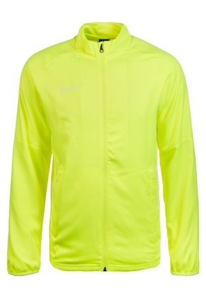 Neonowo żółta lekka kurtka sportowa na zamek błyskawiczny, z długimi rękawami i białym logo Nike Swoosh na lewej piersi.
