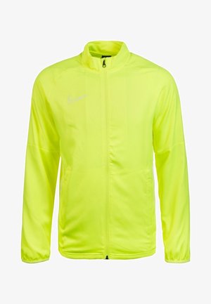 Neongelbe Sportjacke mit durchgehendem Reißverschluss, langen Ärmeln und weißem Nike Swoosh-Logo auf der linken Brust.