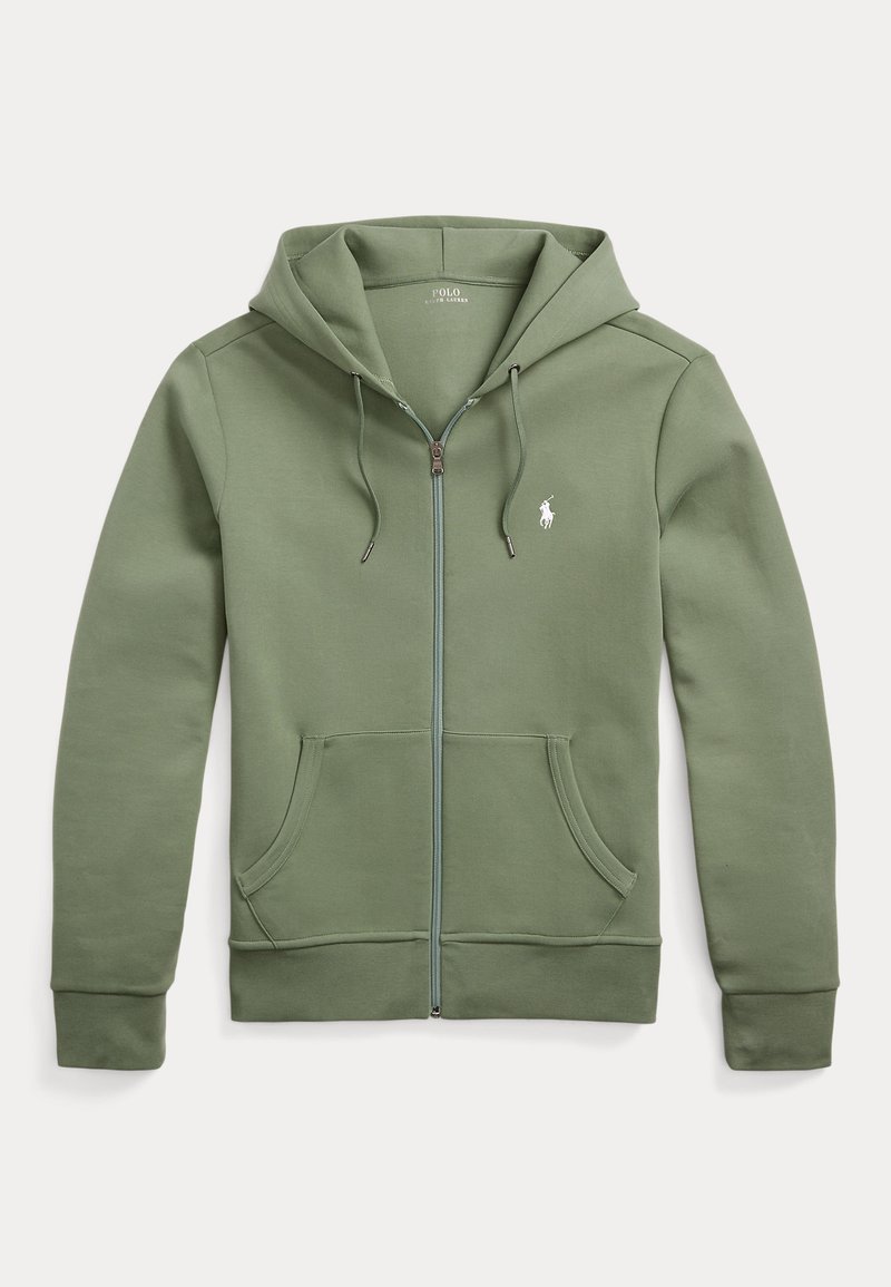 Sweatshirt verde com fecho éclair, feito de tecido macio, apresentando um fecho frontal, dois bolsos laterais e um pequeno logotipo no lado esquerdo do peito.