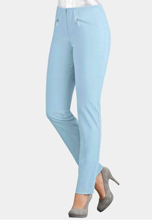Light blue trousers featuring a sleek design, smooth texture, and decorative zippered pockets on the front.