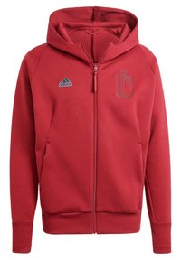 Red zip-up hoodie made of soft fabric, featuring a hood, two front pockets, and embroidered logos on the chest and shoulder.