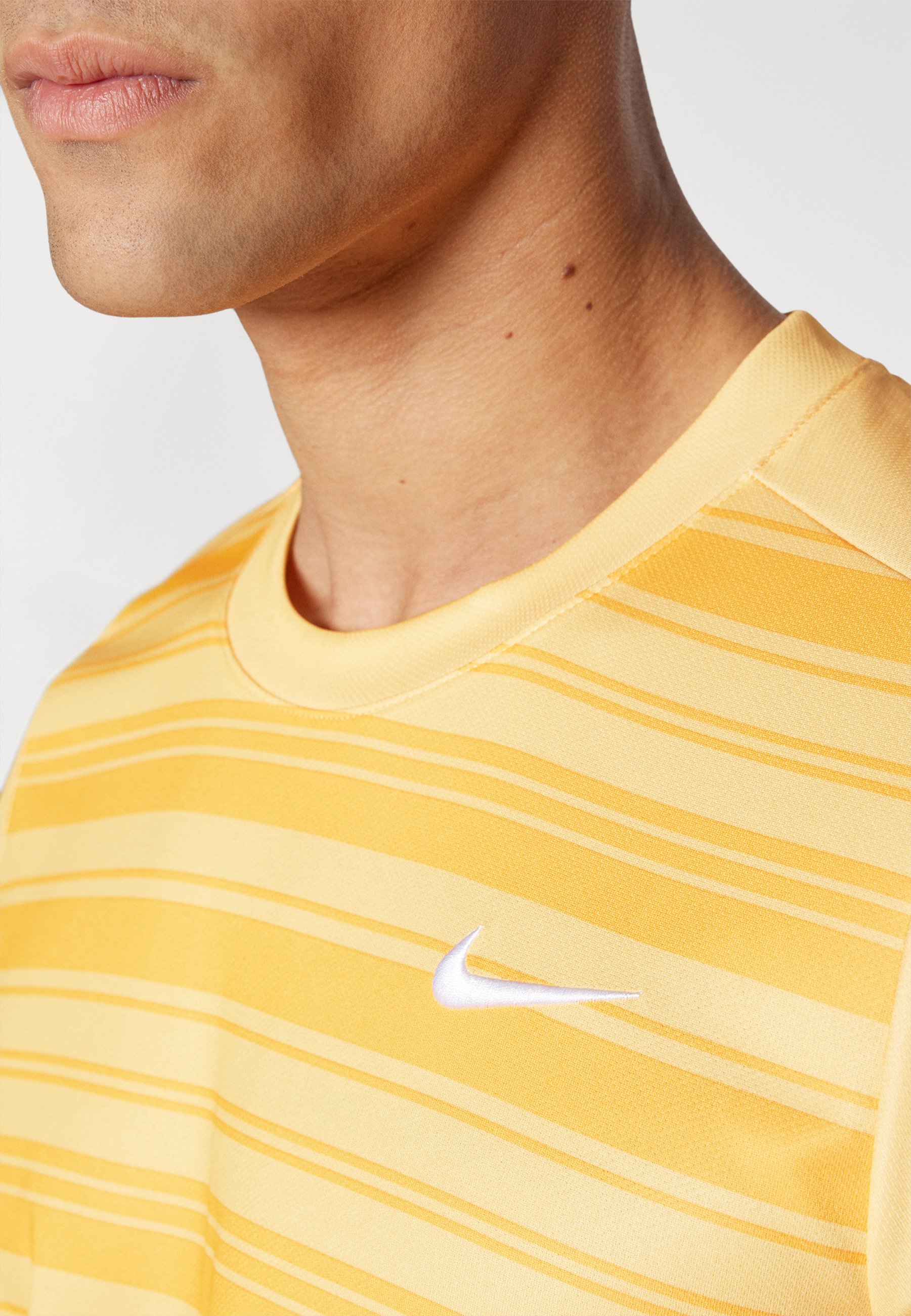topaz gold nike shirt