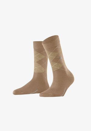 Chaussettes en coton beiges avec un motif en diamants dans des teintes plus claires, agrémentées de lignes blanches contrastantes. Bord-côte en haut ; logo sur le côté.