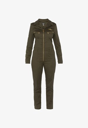 Olivgrüner Jumpsuit aus Baumwollmischung, mit Kragen, goldenem Reißverschluss, zwei Brusttaschen und schmal zulaufenden Beinen mit tailliertem Schnitt.