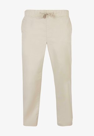 Pantaloni din bumbac bej cu talie elastică și șnur de ajustare. Design cu picior drept, textură netedă și buzunare laterale.