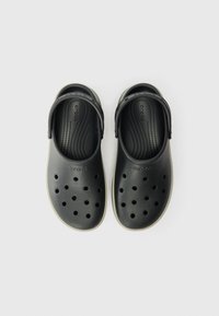 Black Crocs-style clogs with multiple ventilation holes and an adjustable heel strap, textured footbed, and light-colored sole.