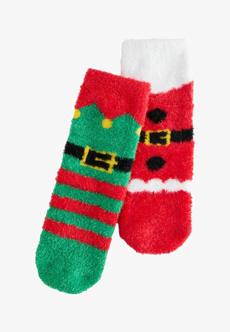 Chaussettes duveteuses avec deux motifs : l'un vert avec des rayures rouges et des accents jaunes, l'autre rouge avec une ceinture de Père Noël et un haut blanc.
