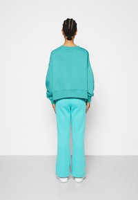 Nike Sportswear TREND CREW OVERSIZED - Camisola - washed teal