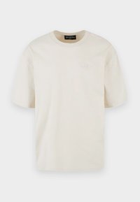 T-shirt semplice beige chiaro a maniche corte con scollo tondo e piccolo logo Dropsite ricamato sul petto a sinistra.