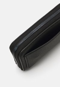 Calvin Klein Jeans MINIMAL MONOGRAM MED ZIP AROUND - Portafoglio - black
