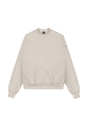 Beige langærmet crewneck-sweatshirt med ribstrikkede manchetter og kant, med et lille rundt logopatch på venstre ærme.