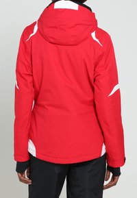 Rote wasserdichte Jacke mit Kapuze, mit weißen Akzenten und einem lockeren Schnitt. Glatte Textur mit einem Reißverschluss und elastischen Bündchen.