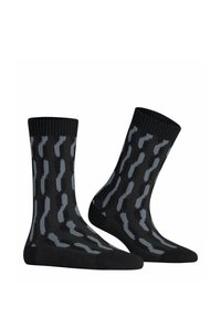 Schwarze Socken mit einem Wellenmuster in Grau. Sie bestehen aus einem strukturierten Material, haben einen gerippten Bund und eine verstärkte Zehenpartie für Langlebigkeit.