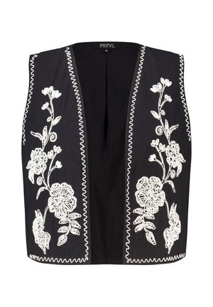 Zwarte mouwloze vest met witte bloemenborduurwerk, ronde halslijn en contrasterende zigzagstiksels langs de randen. Casual ontwerp.