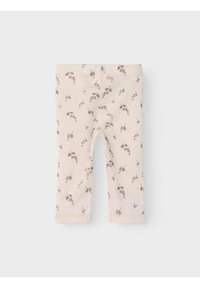 Ljust beige leggings gjorda av mjuk bomull, med ett blommönster i dämpat rosa och grönt. Ankellång med sydda fållar.