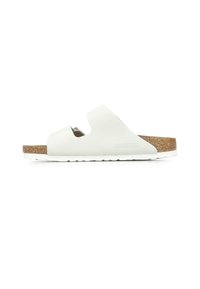 Infradito bianchi con soffice soletta in sughero, suola in gomma e design a ritagli. Presenta una texture liscia e uno stile minimalista.
