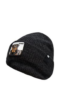 Black knit beanie featuring a square patch with an embroidered dog and the word "GUARD." Soft texture and fitted design.