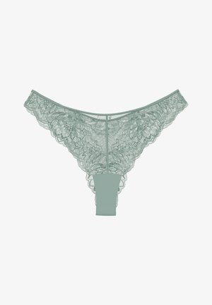 Spitzenstring in sanftem Mintgrün mit kompliziertem Blumenmuster, transparenter Vorderseite und solidem Rückenteil. Die gewellten Kanten verleihen Textur und Detail.