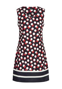 Robe sans manches bleu marine à pois blancs et rouges avec deux bandes horizontales blanches près de l'ourlet.