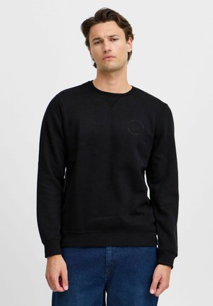 Svart sweatshirt i bomullsblandning med rund halsringning, ribbade ärmslut och en cirkulär logotypdetalj på vänster bröst.