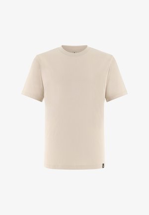 Beżowy t-shirt z krótkim rękawem i okrągłym dekoltem, z małą czarną metką przy dolnym brzegu.