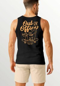 Black tank top featuring orange text "Out of Office" and a cartoon cat on a skateboard, with a playful design and smooth texture.