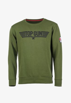 Olivgrünes Sweatshirt mit langen Ärmeln, gerippten Bündchen und Rundhalsausschnitt. Mit einem schwarzen "TOP GUN"-Logo und einem runden Patch am Ärmel.