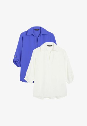 Dva topy: jeden tmavě modrý, druhý bílý. Oba mají límec, tříčtvrteční rukávy s knoflíkovými detaily a volný střih.