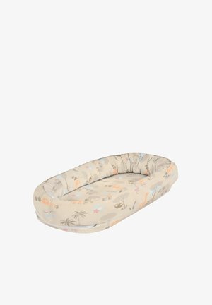 Oval beige infant lounger with raised padded edges and animal print including lions, giraffes, palm trees, and other safari motifs.