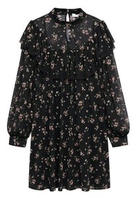 Abito nero floreale con design a strati e volant, maniche lunghe e un'apertura a forma di chiave sul collo. Presenta piccoli motivi floreali rosa e verdi.
