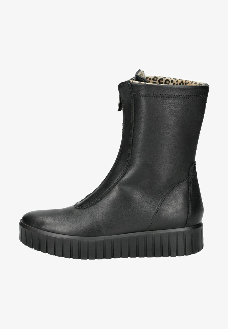 Botín negro de cuero con cremallera lateral, que presenta una suela de goma negra texturizada y un forro interior de estampado de leopardo.