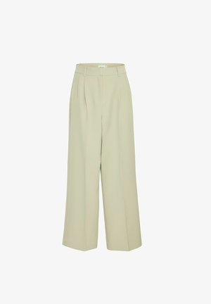Pantalons larges en beige clair, fabriqués à partir d'un tissu lisse. Présentent des plis devant et une taille haute avec des passants de ceinture.