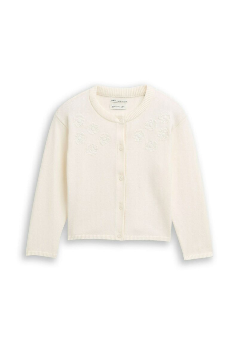 Witte, geribbelde gebreide cardigan met lange mouwen, ronde halslijn en zeven knopen aan de voorkant. Heeft geborduurde bloemenaccenten op de borst.