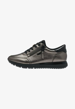 Metallic grey sneaker with a sleek design, featuring black accents, textured surface, and side zipper. Rubber sole for grip and comfort.