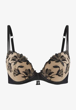 Soutien-gorge en dentelle noire avec des bonnets en maille beige, broderies florales, bretelles réglables et un nœud décoratif avec des franges au centre.