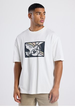 White short-sleeve t-shirt featuring a black graphic design with an abstract bird and geometric elements in pastel colors. Soft fabric.