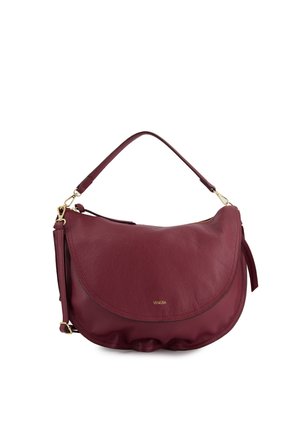 Burgundy leather handbag with a curved flap design, gold hardware accents, and a textured surface. Includes a removable shoulder strap.