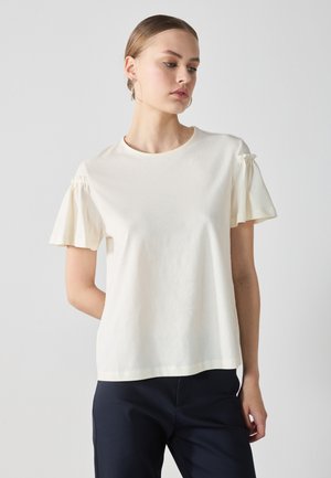 Short-sleeve, cream cotton t-shirt with gathered accents on sleeves, round neckline, and a relaxed fit. Smooth texture and minimal design.