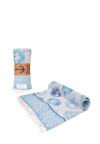 Light blue and white peshtemal towels with nautical patterns, one rolled with a brown label and one partially unrolled showing fringed edges.