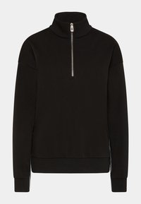 Sudadera negra con cuello alto y media cremallera. Hecha de un tejido suave y texturizado, con un corte holgado y puños acanalados.
