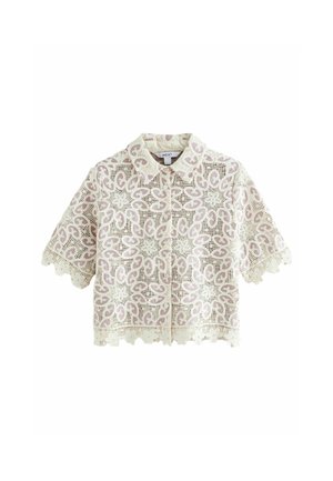 Chemise en dentelle à manches courtes avec un col, présentant un motif aux teintes crème et rose, un ourlet festonné et une fermeture par bouton.